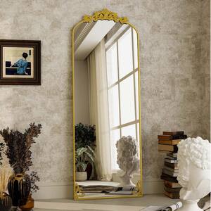 21 in. W x 64 in. H Arched Gold Metal Framed with Carved Decoration Full Length Mirror