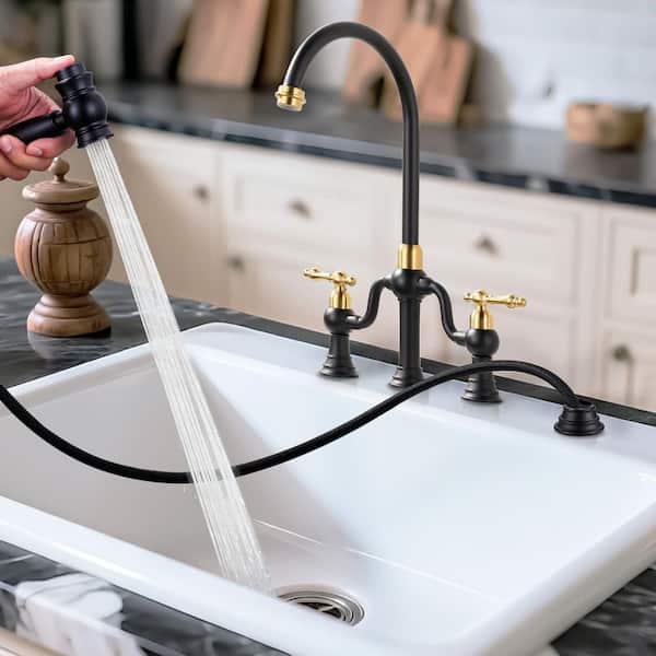 Double Handle High Arc Brass Bridge Kitchen Faucet with Side Sprayer in Black and Gold