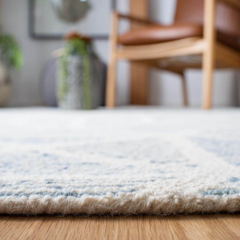 Blue and Ivory Handmade Wool Abstract 9' x 12' Rug