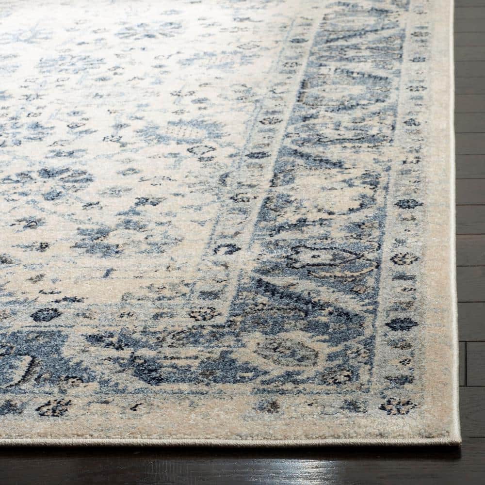 Ivory and Blue 9' x 12' Synthetic Stain-Resistant Area Rug