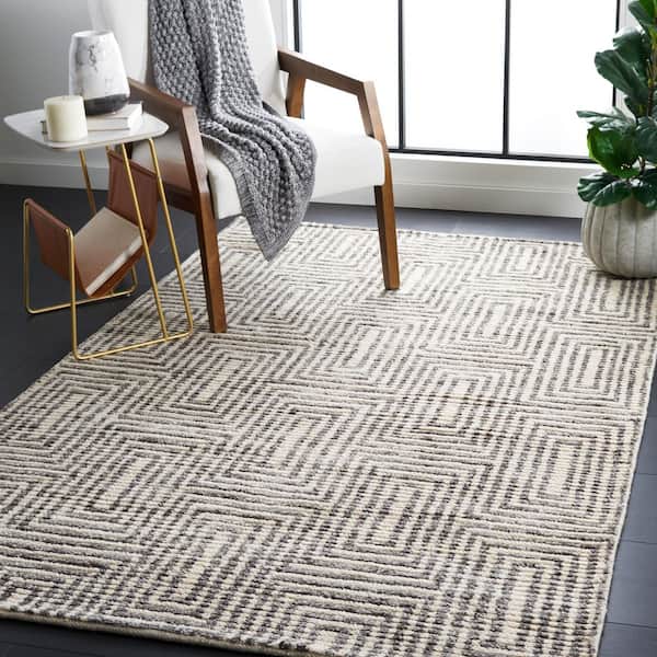 Tibetan 5 ft. x 8 ft. Black/Ivory Geometric Ornate Area Rug