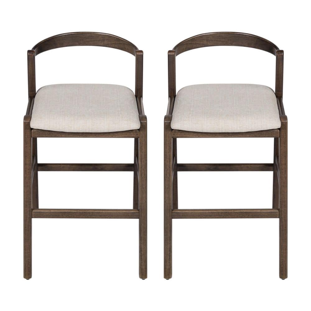 Two dark brown wood bar stools with beige cushions front view.