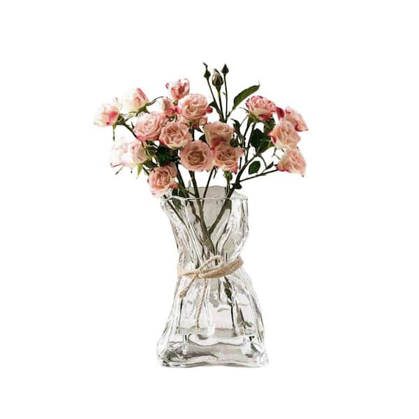 Clear glass irregular vase, 6 in high.