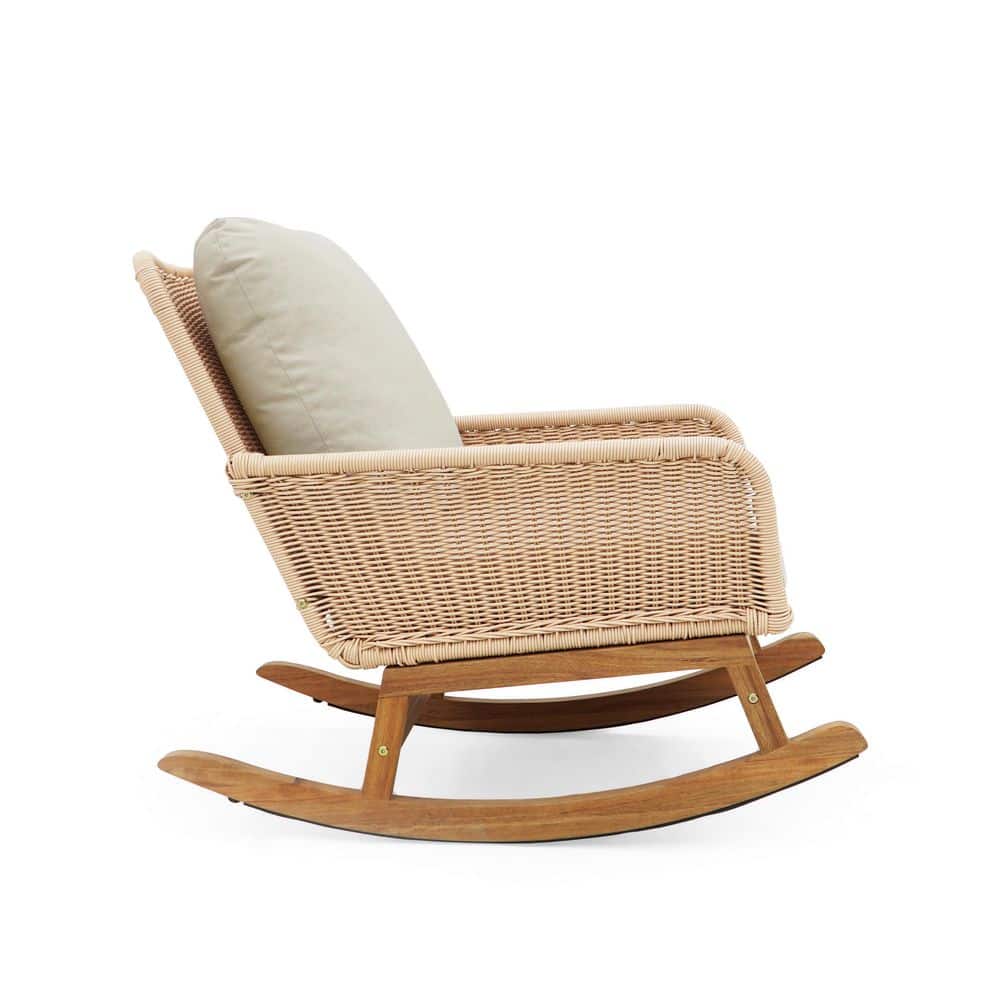 Beige wicker rocking chair in a lifestyle setting.