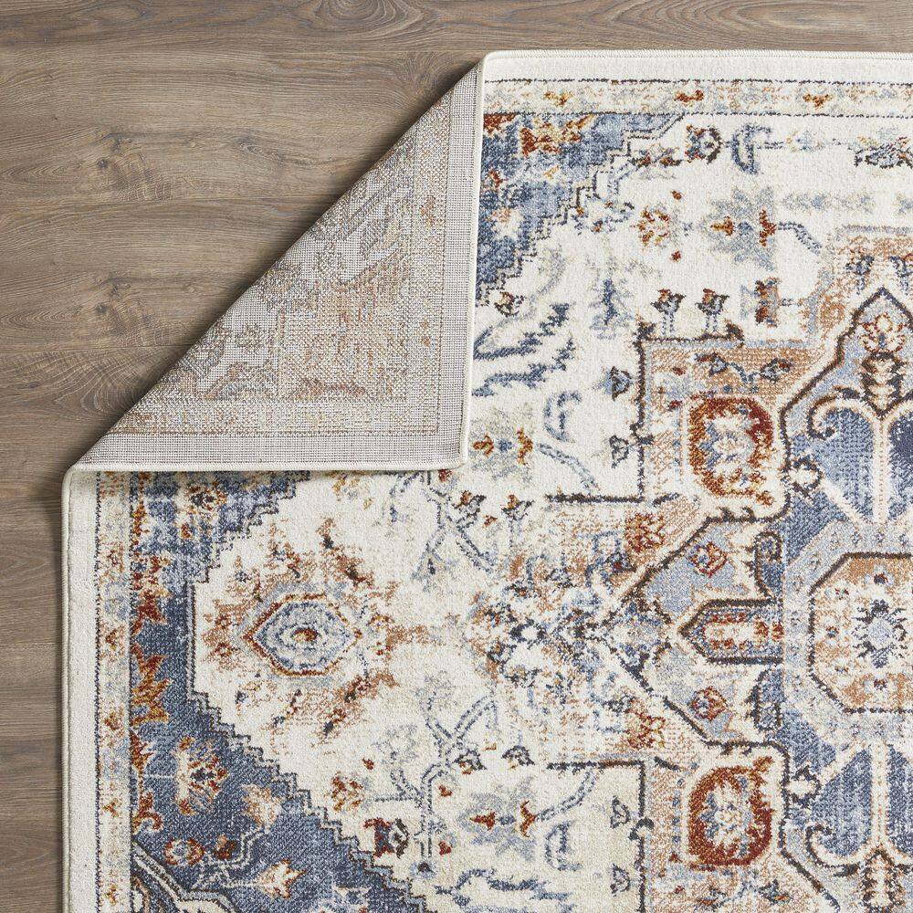 Cream and Blue 6' x 9' Synthetic Oriental Area Rug