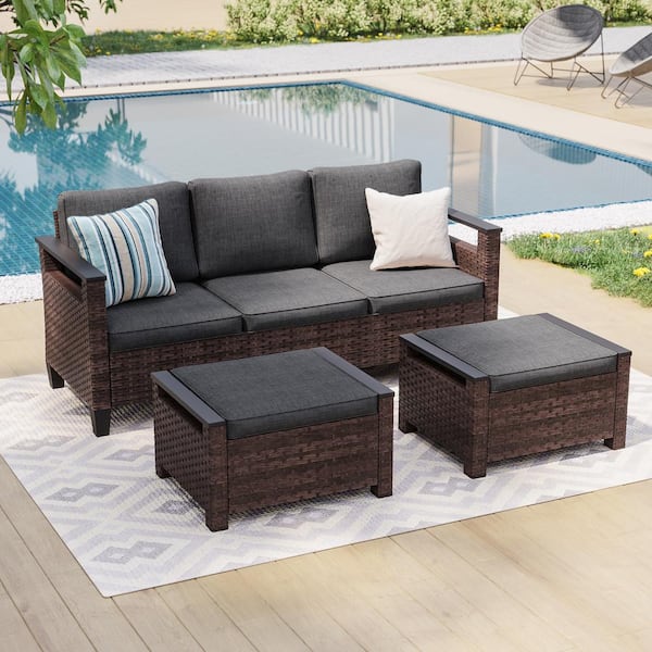 Sonkuki 3-Piece Brown Wicker Black Cushions Patio Conversation Set Comprising a 3-Seater Sofa and 2-Ottomans