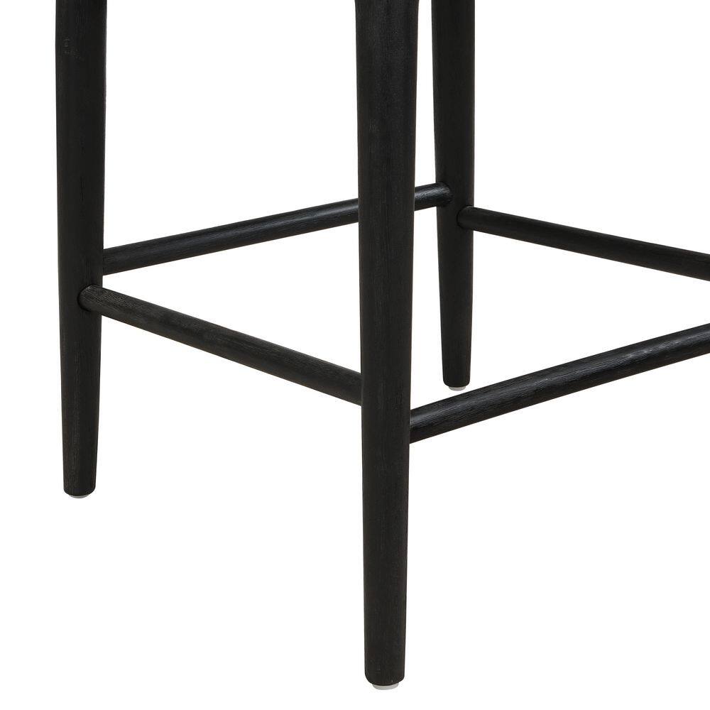 Close-up of the legs and stretchers of a black bar stool.