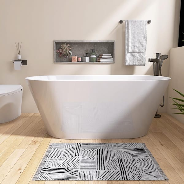 67 in. L x 29.5 in. W x 23 in. H Soaking Bathtub with Center Drain in Gloss White