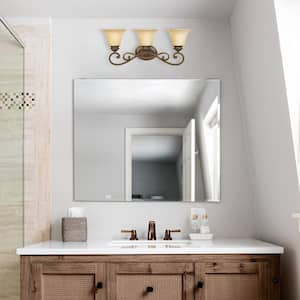 Mendocino 24.25 in. 3-light Forged Sienna Mediterranean indoor vanity with Warm Amber Glaze Glass Shades