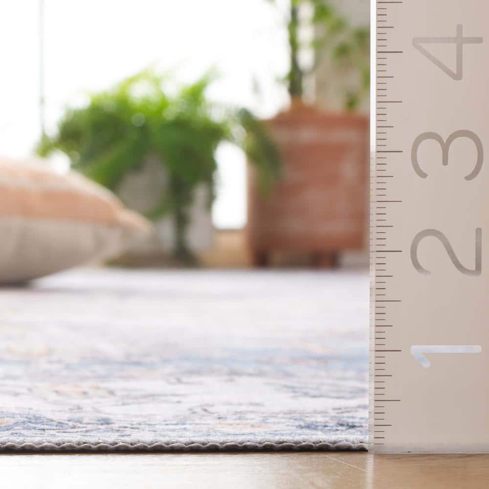 Ivory and Light Blue Weathered Medallion Washable Area Rug