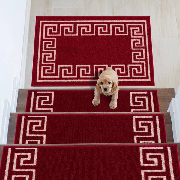 https://images.thdstatic.com/productImages/e4ae9c5e-6d1e-4e6e-a967-2647eee095f2/svn/burgundy-red-stair-tread-covers-adst-19-5x32-mat-greek-key-red-e1_600.jpg