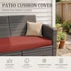 Patio cushion cover on a wicker sofa.