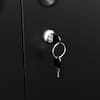 Close-up of a silver lock and key on a black metal cabinet door.