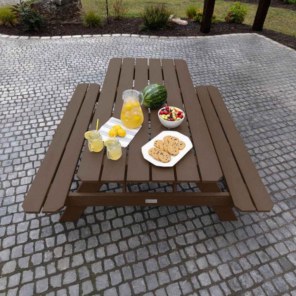 An overhead view of a brown rectangular plastic picnic table.