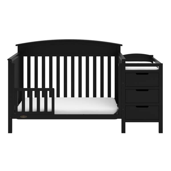 black crib with changing table