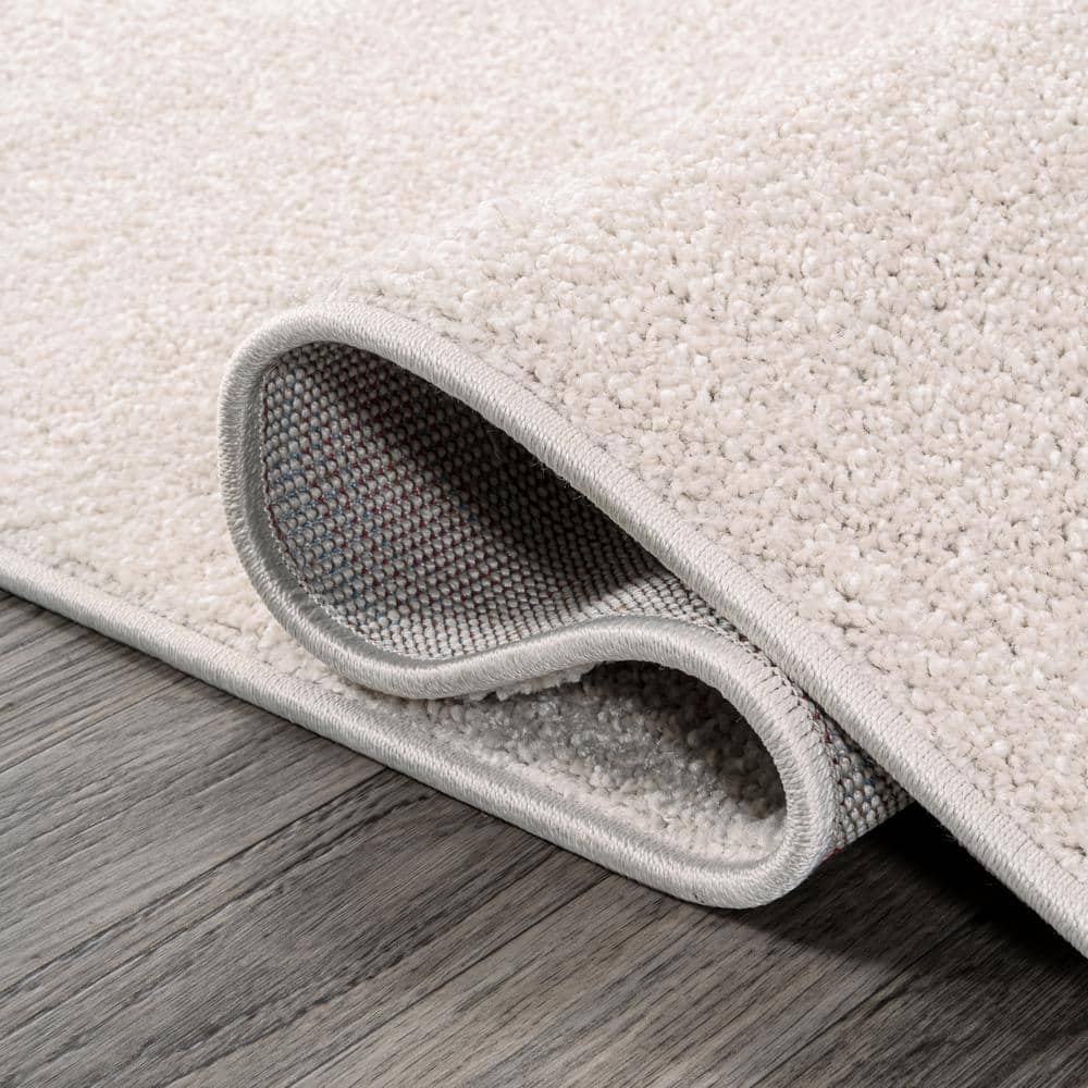 Ivory Solid Synthetic 10' x 14' Reversible Area Rug