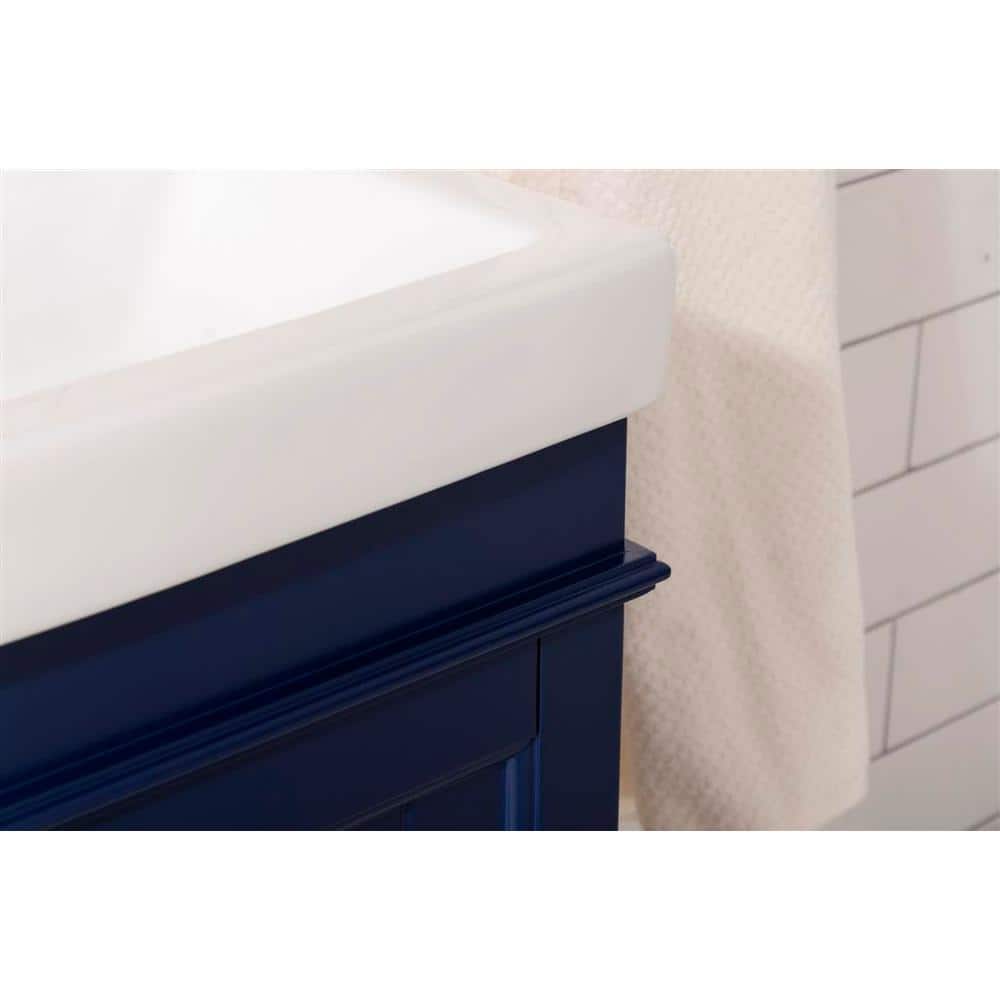 Compact Blue Freestanding Vanity with White Ceramic Sink
