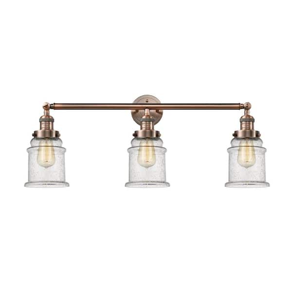 Canton 30 in. 3 Light Antique Copper Vanity Light with Seedy Glass Shade