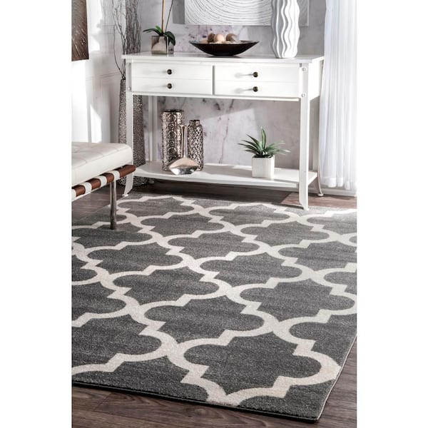 https://images.thdstatic.com/productImages/e5d077c2-146b-48b0-a500-1f81b3561320/svn/gray-nuloom-area-rugs-rzpl02a-71001010-4f_600.jpg