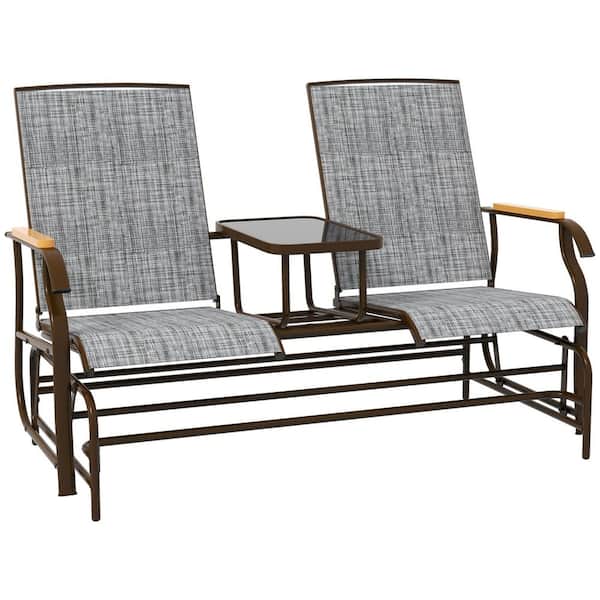 Two outdoor glider benches with glass table on a dark frame.