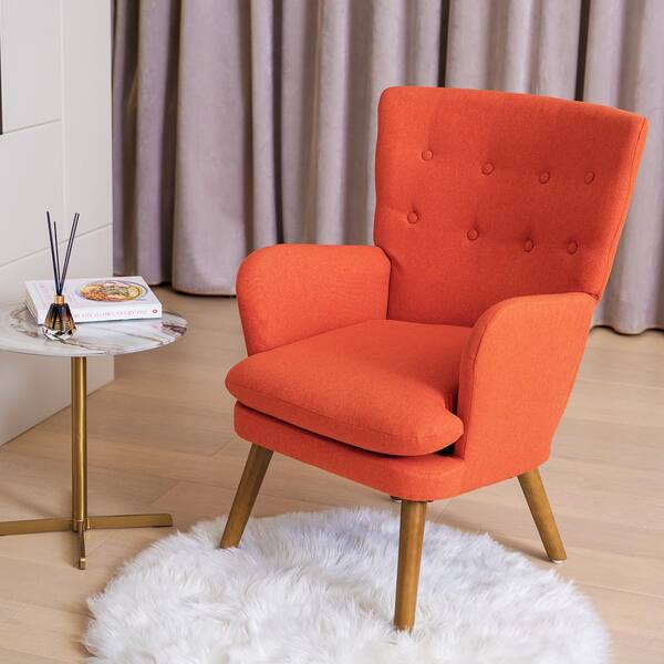 burnt orange armchair and footstool