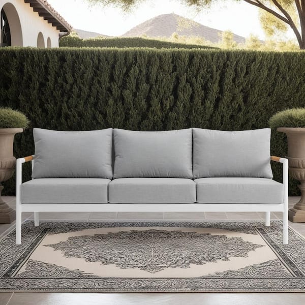 Armen Living Crown White Aluminum and Teak Wood Outdoor Couch with Gray Cushions