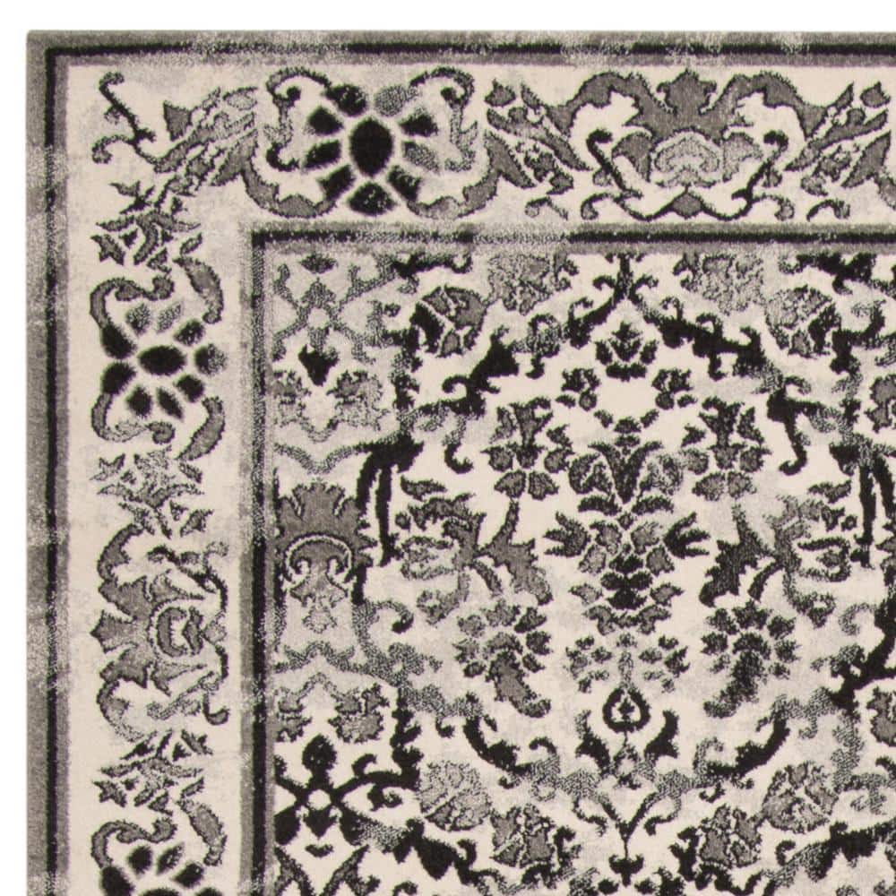 Ivory and Grey 8' x 10' Synthetic Stain-Resistant Area Rug