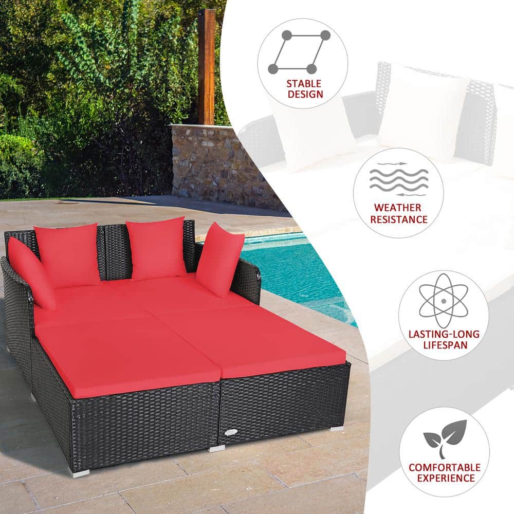 Outdoor Black Rattan Daybed with Red Cushions and Pillows