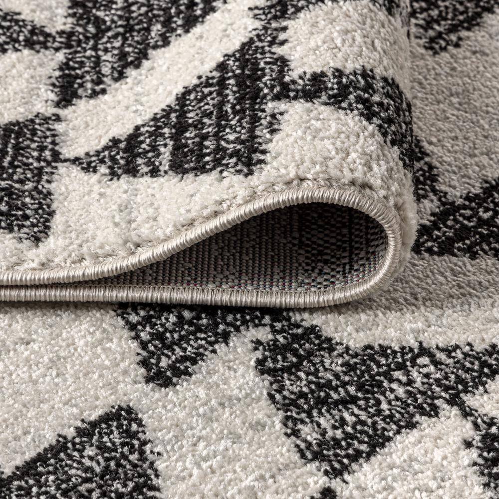 Aisha Cream and Black Geometric Synthetic Area Rug