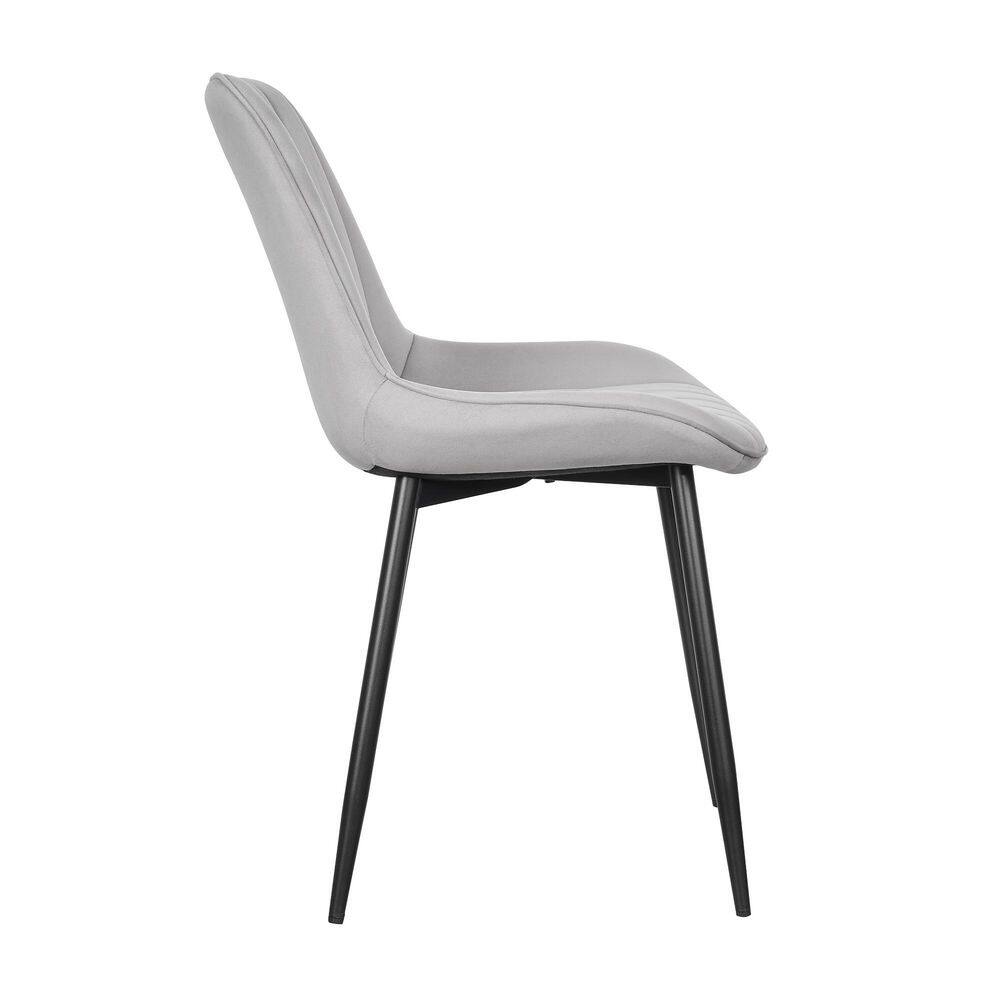 Side profile of a gray velvet dining chair with black metal legs.