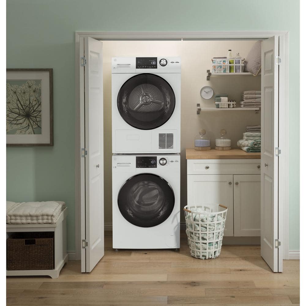 White front-load washer installed next to matching dryer