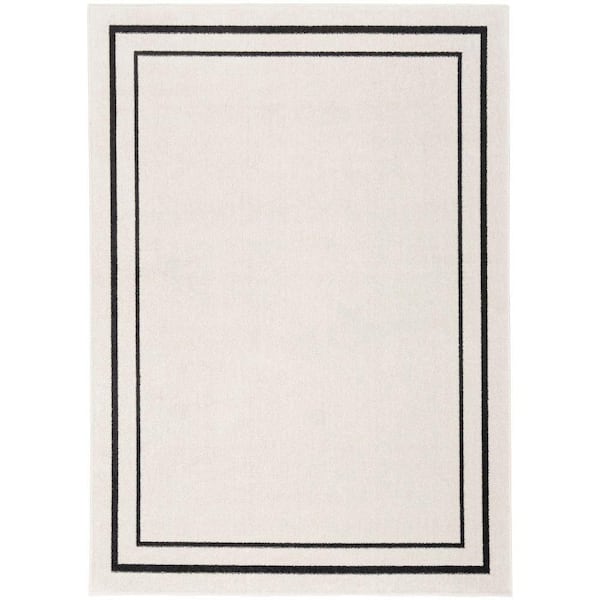 Nourison Essentials Ivory/Black 6 ft. x 9 ft. Solid Contemporary Indoor/Outdoor Area Rug