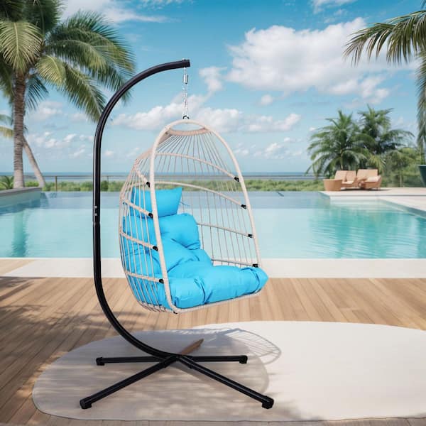 Off-White Wicker Outdoor Lounge Chair with Blue Cushion