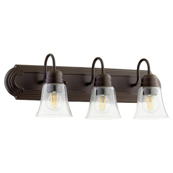 Quorum INTERNATIONAL Campbell Traditional 24 in. Width, 3-Light Oiled Bronze Vanity Lights with Clear Seeded Glass shade