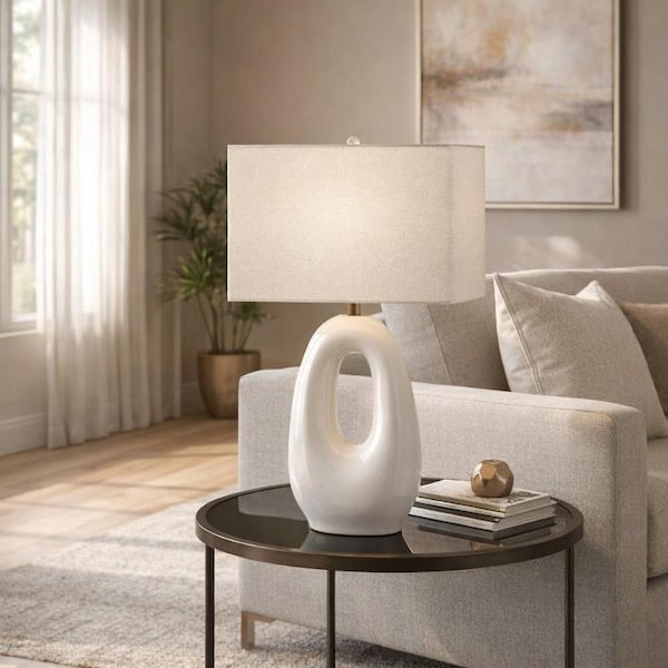 27 in. White Ceramic Open Cut-Out Oval Table Lamp with White Linen Shade