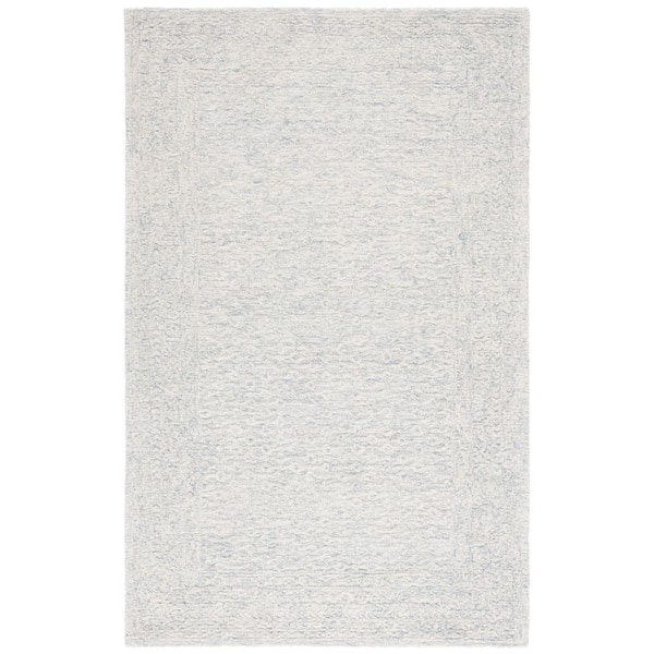 SAFAVIEH Pine 8 ft. x 10 ft. Light Blue/Ivory Modern Solid Area Rug