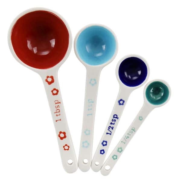https://images.thdstatic.com/productImages/e77bb744-34b3-4637-8944-38577939a30e/svn/white-gibson-home-measuring-cups-measuring-spoons-985118956m-64_600.jpg