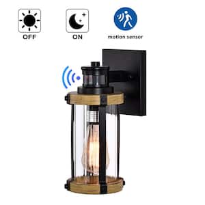 1-Light Black and Woodgrain Motion Sensing Dusk to Dawn Outdoor Wall Sconce with Striped Clear Glass