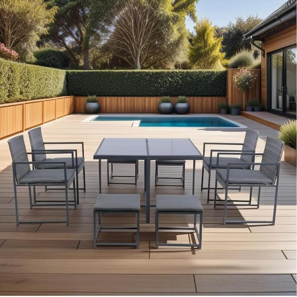 Cisvio 9-Pieces Patio Dining Sets Outdoor Space Saving Rattan Chairs with Glass Table Top Grey Wicker Plus Dark Grey Cushion