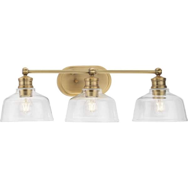 Progress Lighting Singleton 26.5 in. 3-Light Vintage Brass Vanity Light with Clear Glass Shades