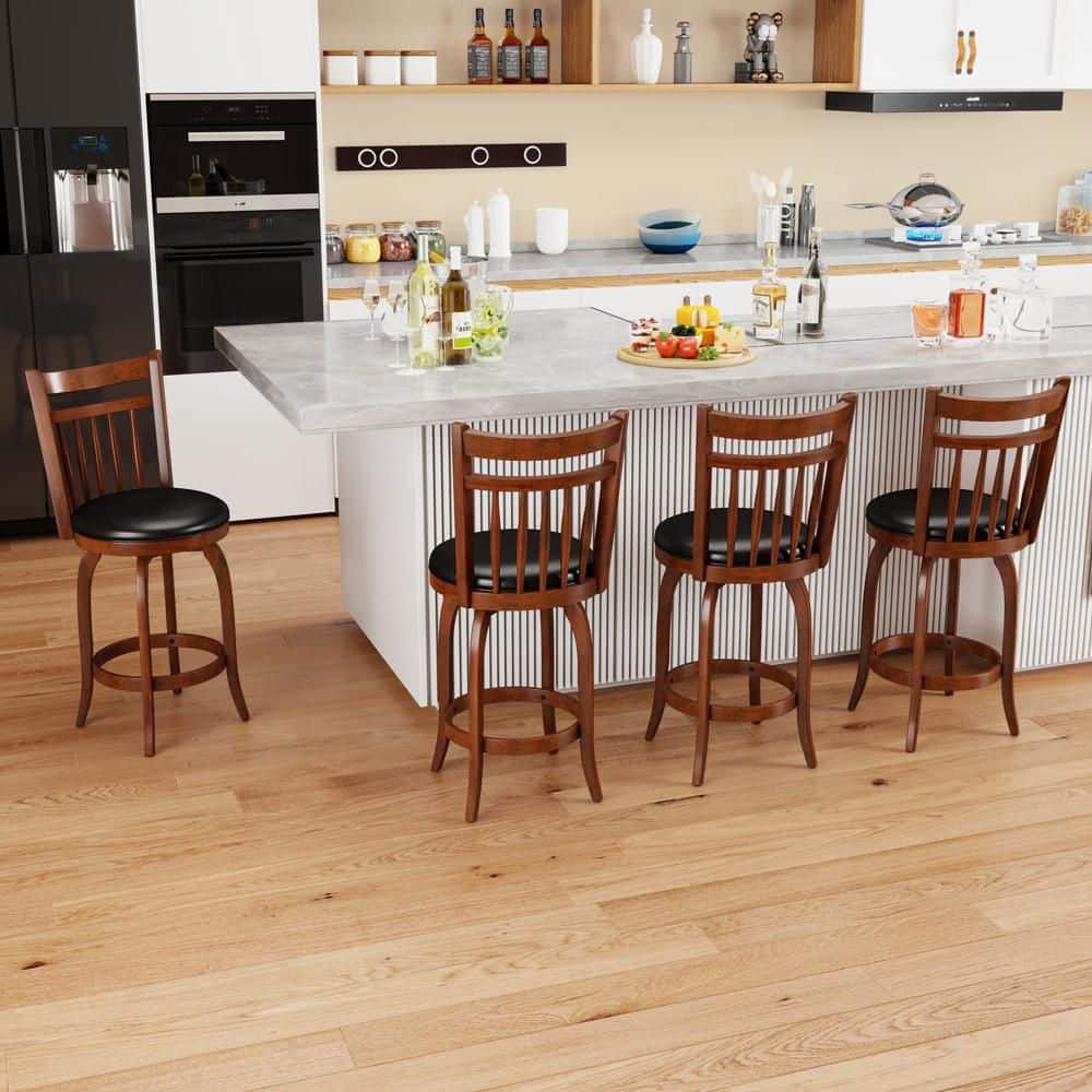 Four wooden bar stools lined up at a kitchen counter.