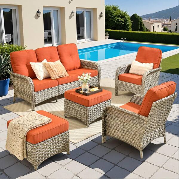 Gerbera A 5-Piece Wicker Patio Conversation Seating Set with Orange Red Cushions and Ottomans