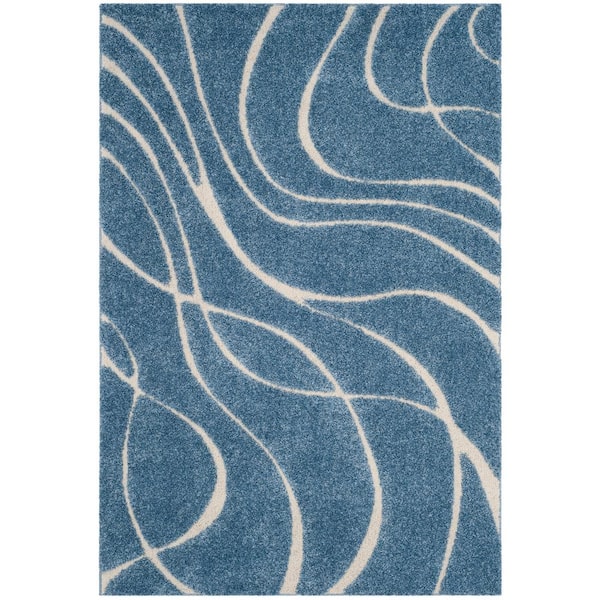 SAFAVIEH Florida Shag Light Blue/Cream 6 ft. x 9 ft. Solid Area Rug
