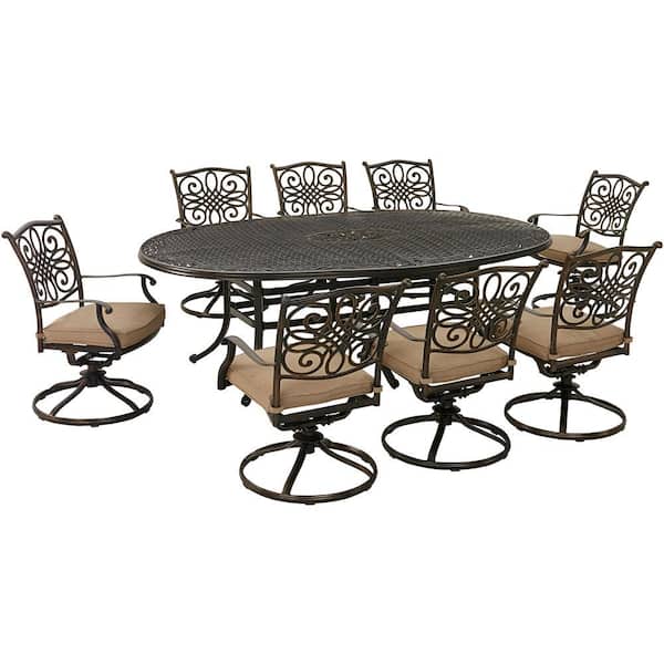 Hanover Traditions 9-Piece Aluminum Outdoor Dining Set with Tan Cushions, 8 Swivel Rockers and Oval Cast-Top Table