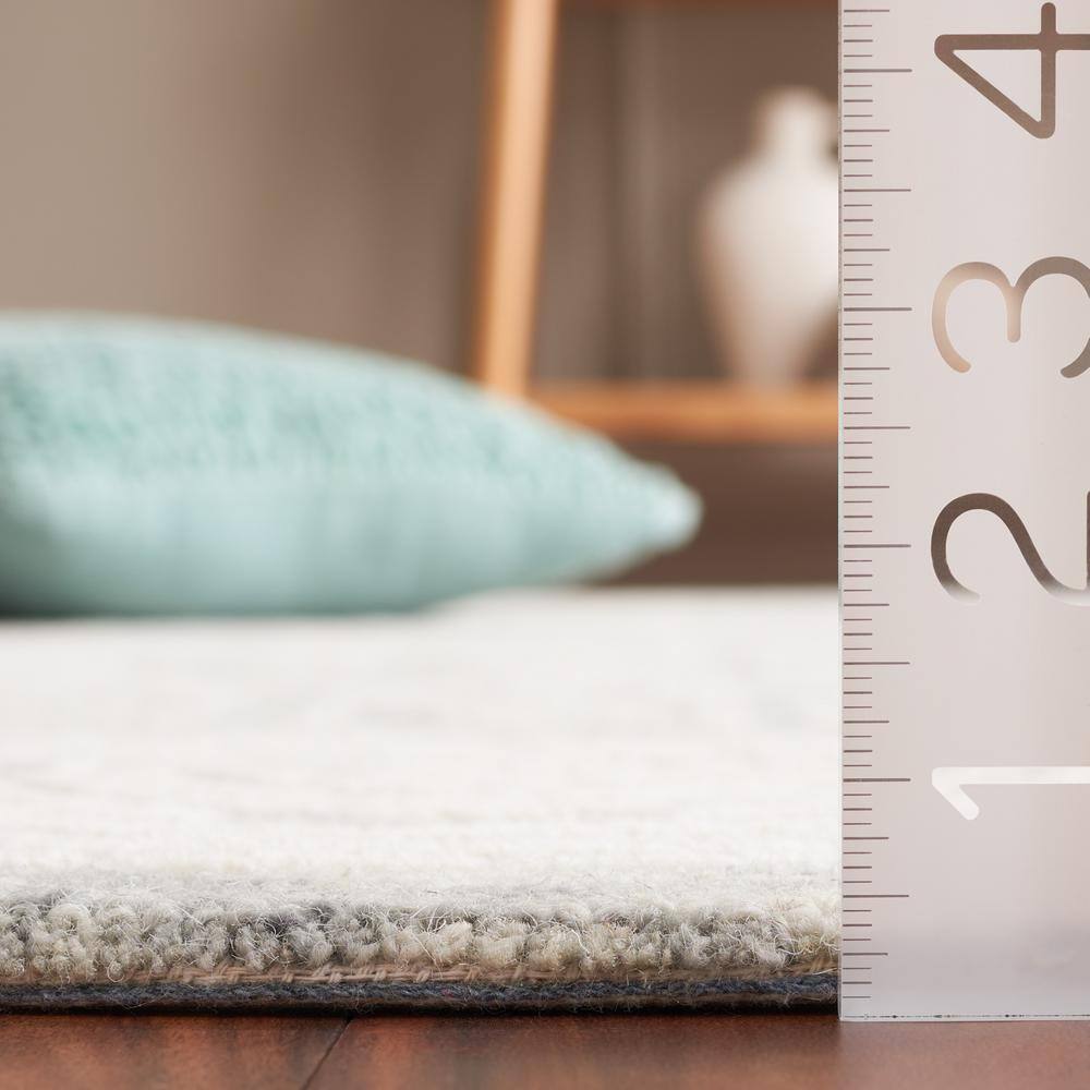 Ivory and Grey Hand Tufted Wool 4' x 6' Area Rug