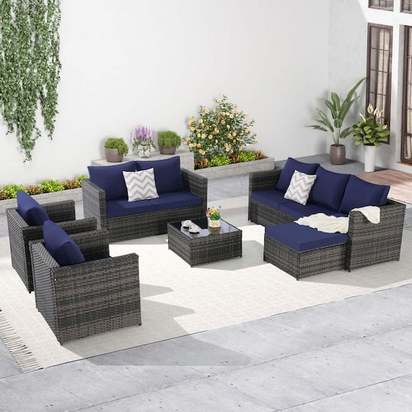 Zeus & Ruta 5-Piece Gray Wicker Outdoor Sectional Sofa Set with Dark Blue Cushions, Pillows and 1 Glass Table