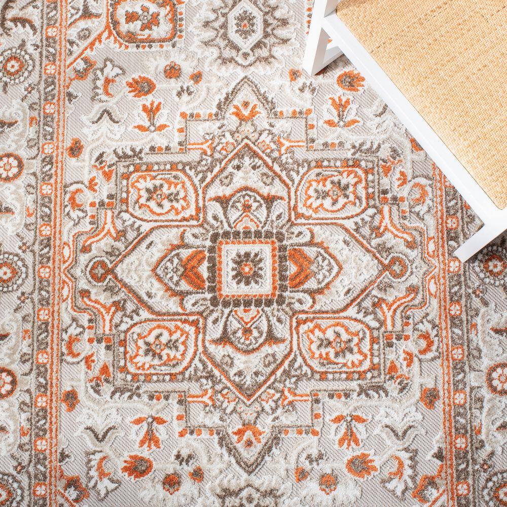Beige and Orange Floral Synthetic Rectangular Area Rug 5'5" x 7'7"