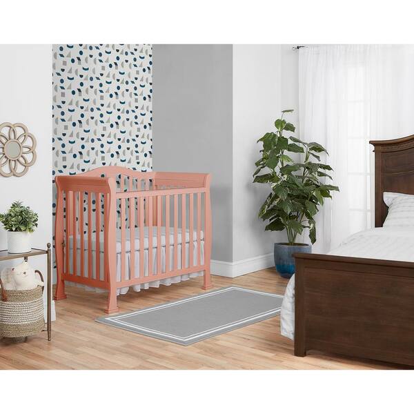 pink mini crib