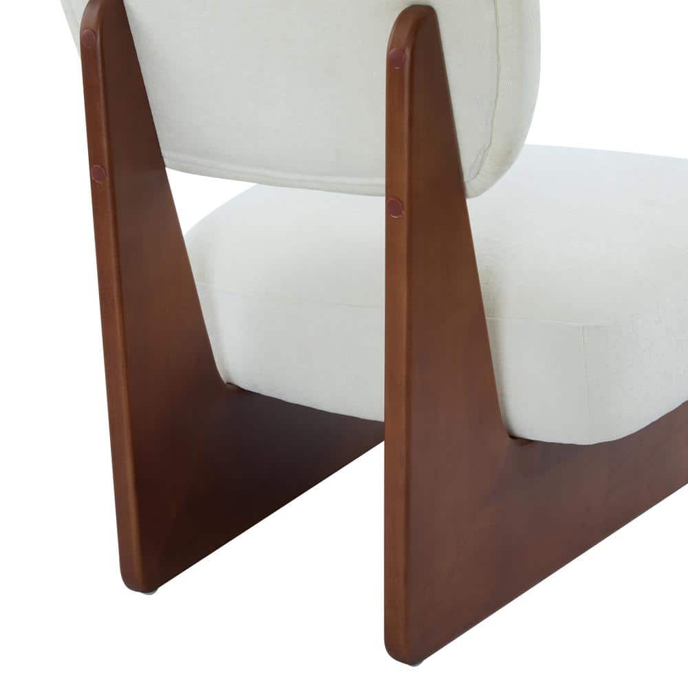 Close-up of the walnut wood base and white upholstery of a lounge chair.