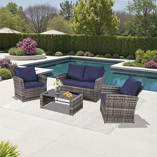 Cesicia 4-Piece Gray Wicker Outdoor Furniture Sectional Set with Glass Table and Blue Cushions